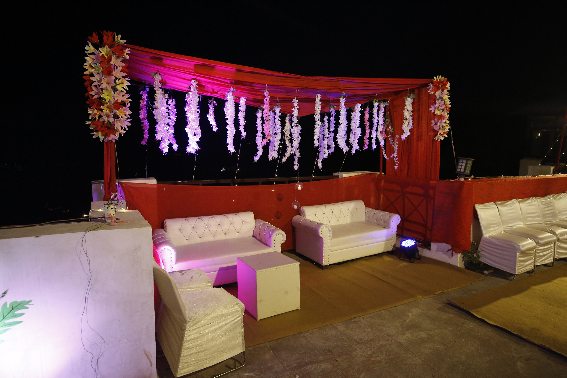 Elegant lounge setup with floral decorations